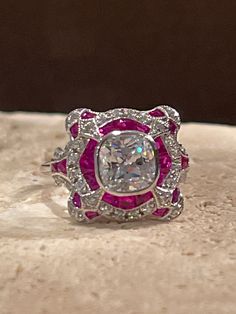 925 sterling silver laser white gold plated custom made French cut man made rubies Center stone approximate weight 2ct AAAAA grade cz  size 6 3/4 Laser Cut Earrings, French Cut, Cz Necklace, Yellow Earrings, Red Band, Deco Ring, Argentium Silver, Cz Earrings, Art Deco Ring