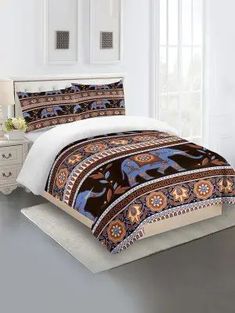 a bed with an elephant design on it