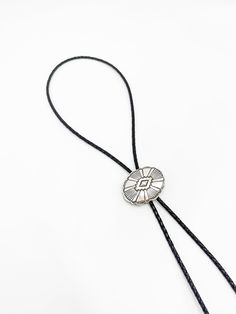 Introducing the Cali Bolo Tie - a chic and timeless accessory inspired by the Western style. Crafted in California, this trending necklace adds a touch of sophistication and effortless style to any outfit. Embrace simplicity and elevate your look with this must-have bolo tie. Trending Necklace, Bolo Tie Necklace, Tie Necklace, Trending Necklaces, Chain Belts, Bolo Tie, Timeless Accessories, Elevate Your Look, Leather Cuffs