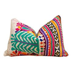 two colorful pillows on a white background