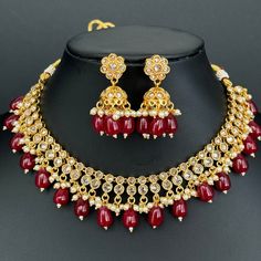 Ruby Gold Polki Necklace South Indian Jewelry Temple Jewelry Guttapusalu Necklace Wedding necklace Antique Classic Necklace With Gold Plating Latest Design Antique Necklace Set Ships from California, USA USA delivery is in 3-5days. This is 100% Handmade jewelry. So the color, shades, and texture displayed may vary slightly from the actual product due to digital image limitations. We request you to consider these minor variations. Please expect the possibility of some slight imperfections when buying handmade jewelry. If you have any questions, please message or email us. Arrives in a gift box. Please let me know if you have any questions. Thank you so much for visiting my shop. Kundan Necklace With Round Beads And Latkans For Wedding, Kundan Necklace With Latkans And Round Beads For Wedding, Wedding Beaded Necklaces With Latkans And Round Beads, Wedding Beaded Necklace With Latkans For Diwali, Heavy Round Bead Necklaces For Wedding, Festive Latkan Necklaces For Marriage, Festive Latkans Necklace For Marriage, Gold Necklaces With Round Beads For Marriage, Red Pearl Necklace For Wedding And Festivals