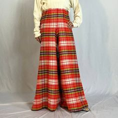 "1960s Plaid Elephant Bell Bottoms Super fun and seasonal bright red plaid elephant bell bottoms from the 1960s. Elastic waistband, and likely 100% acrylic. Tagged a vintage size 10 but would best fit a petite modern XXS-S, depending on desired fit. (Model is 5'1\") Waist: 24-28\" Hip: 42\" Rise: 14\" Thigh: 13.5\" flat Inseam: 29.5\" Flare: 43\" Condition: Excellent, no flaws to note." Retro Red Bottoms For Fall, Retro Plaid Pants For Fall, Red Vintage Bottoms For Fall, Vintage Red Pants For Fall, Retro Red Bottoms For Winter, Art Teacher Outfits, 60s Mod, Autumn 2024, Womens Pants