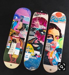 three skateboards with different designs on them are lined up against a black background,