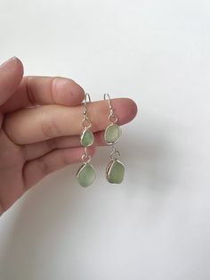 Nickel-free Teardrop Earrings In Recycled Glass, Nickel-free Teardrop Earrings Made Of Recycled Glass, Teardrop Sea Glass Earrings With Ear Wire, Green Dangle Earrings In Recycled Glass, Green Dangle Earrings With Recycled Glass, Green Recycled Glass Dangle Earrings, Silver Sea Glass Drop Earrings, Nickel-free Sea Glass Earrings For Jewelry Making, Nickel-free Teardrop Recycled Glass Jewelry