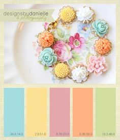 a plate with some flowers on it next to a color swat list for different colors