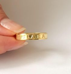 PERSONALIZED NAME and WORD RING This minimalist and Dainty custom Name Ring, Minimalist Name Ring can be worn every day. Personalize this ring with your name, Roman numerals, coordinates and words. Simple and elegant design makes a perfect gift for all special occasions! FEATURES Material: Crafted in 18K Gold plated .925 Sterling Silver and 14K solid Gold Color: Silver, Gold, Rose Gold The item will come with a gift box. The premium hand formed ring is 4mm wide and 1mm thick All our jewelry is % Custom Name Initial Ring For Engagement, Luxury Statement Engraved Ring Gift, Engraved Rings Personalized Wedding, Custom Name Ring, Ring With Name, Engraved Rings Personalized, Ring For Women Gold, Roman Numeral Ring, Mantra Ring