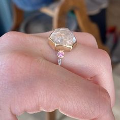 This morganite is a showstopper, that is for sure. The pink side Sapphires make this beauty pop. It is set in 14k yellow gold and is finished on a hand textured sterling silver band. Approx Stone Size: 13mm x 12mm Approx Ct Weight: 8.7 ct Mohs Stone Hardness: 7.5-8 This one of a kind piece is handmade with love in Emily's Hudson Valley studio. If you have questions about sizing, shipping or need help deciding on your perfect piece please reach out to us! Birthstone Stacking Rings, Beauty Pop, Local Jewelry, Morganite Ring, Diamond Shop, Pop It, Sterling Silver Bands, Hudson Valley, Jewelry Rings Engagement