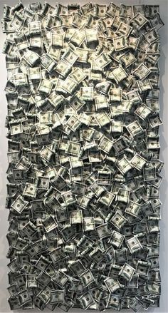 a large amount of money is hanging on the wall