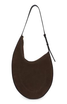 Minimalist styling lets the impeccable leather craftsmanship shine on this slim hobo made of velvety suede set off with smooth leather. Top zip closure Adjustable shoulder strap Leather Made in Italy Designer Handbags Evening Suede Hobo Bag With Soft Leather, Modern Leather Hobo Bag With Suede Lining, Elegant Suede Shoulder Bag With Zipper, Elegant Suede Shoulder Bag With Zipper Closure, Suede Set, Suede Hobo Bag, Shine On, Leather Top, Hobo Bag