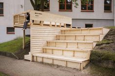 a man standing on top of wooden steps