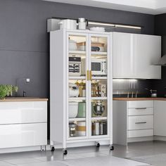 a white refrigerator freezer sitting inside of a kitchen