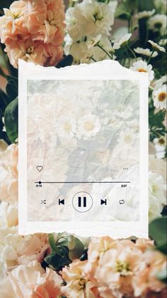 an mp3 player surrounded by flowers and greenery with the words music on it's screen