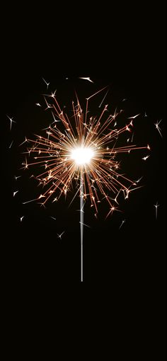 a sparkler that is lit up in the dark