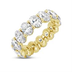 a yellow gold ring with five round cut diamonds on the side and four rows of smaller stones