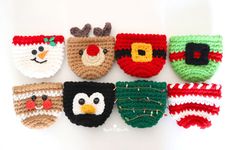 crocheted christmas ornaments are arranged on a white surface, including santa's hats and reindeer noses