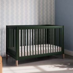 a baby crib in the corner of a room