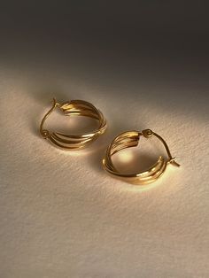 DESCRIPTIONHere’s a TWIST on your classic gold hoops. These babies feature a triple twist design that makes a bold & chunky impact with minimum lightweight effort. TWIST the rules & make a statement at the same time. DETAILS - always made in 14k gold- hoop diameter: 14mm- hoop width: 5mm Gold Hoop Earrings Outfit, Engagement Earrings, Golden Earrings, Senior Pics, Classic Gold, Gold Hoops, Gold Hoop, Hook Earrings, Gold Hoop Earrings