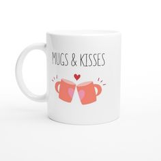 two mugs with the words hugs and kisses written on them, both holding hearts