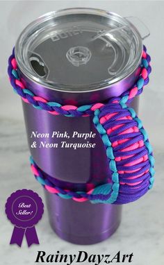 a purple and blue coffee cup with a pink rope around it