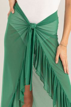 The Ruffle Trim Cover Up Sarong Skirt is a stylish and versatile piece that adds a touch of femininity to any beach or poolside look. Its ruffle trim detail adds a playful and flirty element, while the sarong style allows for easy wear and adjustable fit. Made from lightweight and breathable fabric, this skirt provides coverage while still allowing for air flow. Whether paired with a bikini or a tank top, this sarong skirt is a must-have for any summer wardrobe. Features: Ruffled, Tied Stretch: Slightly stretchy Material composition: 90% polyester, 10% spandex Care instructions: Machine wash cold. Tumble dry low. Imported Product measurements: S:Waist 26-27 in, HIP 35-36 inM:Waist 28-29 in, HIP 38-40 inL:Waist 30-31 in, HIP 42-44 in Sarong Style, Little Black Dress Outfit, Strapless Sundress, Sarong Skirt, Classic White Shirt, Black Dress Outfits, Crop Top Shirts, Air Circulation, Jumpsuit Shorts Rompers