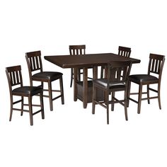 a wooden table with four chairs and a brown dining room set on top of it