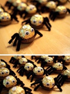 there are many small gold and black spider decorations on the table, each decorated with googly eyes