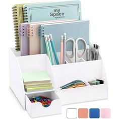 a white desk organizer with pens, pencils, and other office supplies in it