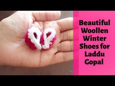 a person holding a small knitted heart in their hand with the words beautiful woolen winter shoes for ladu gopal