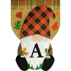 an autumn gnome door hanger with the letter a on it