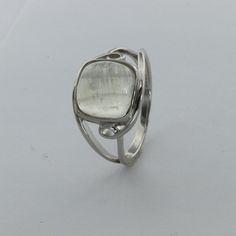 These is a beautiful pair of Sterling Silver R ing with a Rainbow Moonstone Gemstone. The ring are made out of solid 925 Silver and there is no nickel or other substances causing most allergies. This makes the ring hypo allergenic. Size of the Moonstone 1.0 x 1.0 cm or 0.39 x 0.39 inch You will receive the item in a gift box - perfect to surprise someone or yourself. Usually we ship on the same day we receive the payment for the order. We want you to be happy with your purchase. If you do not li White Sterling Silver Ring With Polished Finish, White Sterling Silver Rings With Polished Finish, Modern Oval Silver Gemstones, Modern White Gold Crystal Ring With Gemstone, Sterling Silver White Gold Gemstones For Wedding, White Gold Sterling Silver Gemstones For Wedding, Polished Moonstone Round Rings, Polished White Moonstone Ring In Sterling Silver, White Polished Moonstone Ring In Sterling Silver