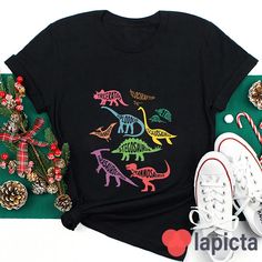 ✔️ TITTLE : Meet Dinosaurs With Me Teacher T-Shirt, Dinosaur Shirt, Dinosaur Lover Shirt, Kindergarten Shirt, Teacher Shirt, Gift For Teacher ✔️ IMPORTANT: Both Men and Women can we our shirts because this is unisex style t-shirts; Wash item inside out in cold water, do not bleach, do not dry clean, do not iron directly on the design. ✔️ MATERIAL DETAILS: 5.3-ounce, 100% cotton (99/1 cotton/poly (Ash) & 90/10 cotton/poly (Sport Grey); Heavyweight classic unisex tee; Taped neck and shoulders; Tea Fun Short Sleeve Tops With Dinosaur Print, Black Dinosaur Print Crew Neck Top, Black Dinosaur Print Short Sleeve T-shirt, Black Short Sleeve T-shirt With Dinosaur Print, Kindergarten Shirts, Dinosaur Shirt, Tee Shirt Designs, Gift For Teacher, Teacher Tshirts