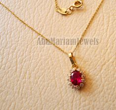 Red stone 18K yellow gold necklace pendant and chain corundum synthetic ruby and cubic Zirconia fine jewelry full insured shipping gold : 18 k gold Stone : Red Corundum ( Synthetic Ruby ) + Cubic Zirconia Approx. weight : 2.5 gram stamped 750 - 18 K Nice gift box included . certificate invoice from our shop of weight and gold purity . Risk free Quality guarantee policy : If you are not satisfied with your item for any reason simply send it to us and you will get a replacement or refund . Pendant Gold Oval Ruby Necklace, Oval Ruby Gold Necklace, Ruby Oval Pendant Necklace In Yellow Gold, Yellow Gold Ruby Oval Pendant Necklace, Oval Ruby Necklace In Yellow Gold, 18k Gold Necklace, Yellow Gold Necklace, Ruby Pendant, Gold Necklaces