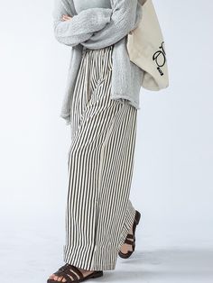 Elevate your ensemble with these high-waisted striped trousers, boasting a loose fit and split-joint accents. Offering both style and comfort, they're a versatile choice for any occasion. Styling Striped Pants, Striped Cotton Wide Leg Ankle-length Pants, Striped Wide-leg Pants For Day Out, Striped Wide Leg Pants For Day Out, Wide Leg Striped Pants For Day Out, Casual Striped Wide Leg Bottoms, Casual Striped Wide Leg Work Pants, Casual Striped Wide Leg Pants For Work, Striped High-waisted Pants For Day Out