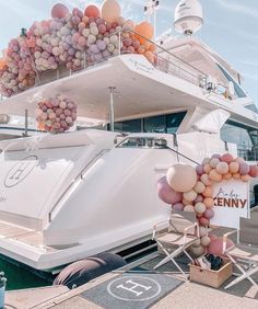 a large white boat with balloons attached to it