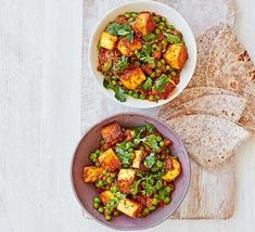 two bowls filled with tofu and peas next to tortillas