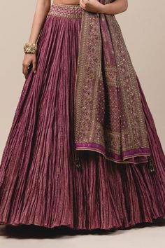 Purple crushed striped zari chanderi lehenga paired with blouse enhanced with zardozi, kasab and kundans. Comes with detachable brocade drape-dupatta embroidered in kasab and sequins.
Component: 3
Embroidered
Neckline: V Neck
Sleeve Length: Half
Fabric: Chanderi, Brocade
Color: Purple
Tassel tie-up back
Bead tassels - Aza Fashions Designer Slub Silk Lehenga With Dori Work, Bollywood Style Slub Silk Lehenga, Reception Slub Silk Lehenga With Zari Work, Unstitched Slub Silk Lehenga With Dori Work, Bollywood Tussar Silk Anarkali Set For Reception, Tussar Silk Sharara For Diwali Reception, Bollywood Style Tussar Silk Sharara For Reception, Diwali Special Chandbali Slub Silk Lehenga, Designer Wear Floor-length Slub Silk Lehenga