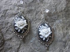 "For sale are beautiful flawless (white rose with a single bud on a striking black background) cameo earrings. The cameos are gorgeous, very detailed I can make any cameo in my store into these pretty earrings, so feel free to browse, message me and I will be glad to set up a custom listing They are offered at a reasonable price, make perfect gifts, and are wonderful quality The cameos are set in a Tibetan silver setting (lead and nickel free), they measure 2\" x 1 1/2\", please see the photo. T Formal White Jewelry With Rose Design, Formal White Rose Design Jewelry, Victorian Rose Design Jewelry For Formal Occasions, Formal Silver Earrings With Rose Design, Silver Rose Design Earrings For Formal Occasions, Silver Earrings With Rose Design For Formal Events, Silver Rose Design Earrings For Wedding, Cameo Earrings, Antique Roses