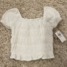 Old Navy White Elastic Toddler Top With Puff Sleeve Size 18m Cute Solid Color Tops With Puff Sleeves, Cute Solid Puff Sleeve Tops, Cute Solid Color Puff Sleeve Tops, Casual Fitted Tops For Playtime, White Spring Blouse For Playtime, White Puff Sleeve Top For Summer, Cute Summer Blouse For Playtime, Cute Summer Playtime Blouse, Casual Spring Blouse For Playtime