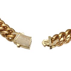 The Pave Clasp Miami Cuban Link Chain. Featuring a large and distinctive rectangular box clasp, encrusted with clear stones that create a dazzling shine. This substantial piece makes a statement, adding a touch of opulence to any outfit. PVD Plating guarantees a long-lasting finish Chunky Chain Link Cubic Zirconia Jewelry, Chunky Chain Cubic Zirconia Jewelry Gift, Chunky Chain Jewelry With Cubic Zirconia As A Gift, Cubic Zirconia Chunky Chain Jewelry Gift, Gift Jewelry With Chunky Chain And Cubic Zirconia, Elegant Diamond Jewelry With Chunky Chain, Luxury Chunky Cuban Link Chain Jewelry, Luxury Cuban Link Chunky Chain Jewelry, Rectangular Cubic Zirconia Jewelry With Rhinestones