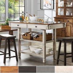 a kitchen island with two stools in front of it