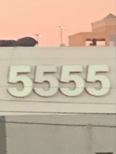 a sign that reads 555 is on the side of a building