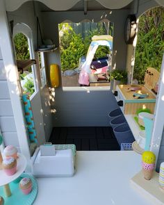 the inside of a play house with toys