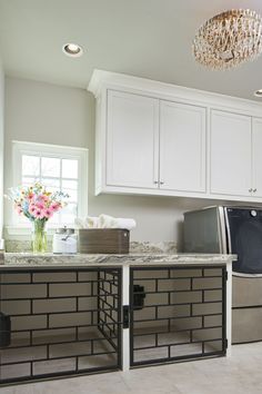 a washer and dryer in a white kitchen