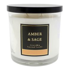 an amber and sage scented candle on a white background