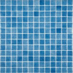 a blue tiled wall with white squares