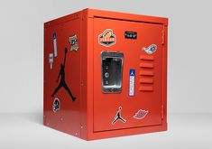 an orange locker with stickers on it