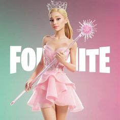 a barbie doll holding a wand and wearing a tiara with the word fortte on it