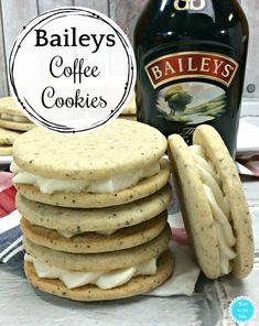 bailey's coffee cookies are stacked on top of each other next to a bottle of beer