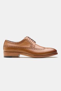 Tan blucher shoes with brogue pattern and stitchline thread embroidery. - Aza Fashions Classic Wingtip Lace-up Shoes With Stitched Sole, Timeless Wingtip Dress Shoes With Stitched Sole, Timeless Dress Shoes With Stitched Sole And Wingtip, Wingtip Oxfords With Stitched Sole For Derby, Derby Wingtip Oxfords With Stitched Sole, Wingtip Lace-up Shoes For Derby With Stitched Sole, Brown Wingtip Derby With Stitched Sole, Semi-formal Wingtip Lace-up Shoes With Stitched Sole, Wingtip Oxford Dress Shoes With Stitched Sole