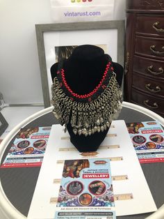 *This heavy tribal set is epitome of tribal culture and traditions. This antique tribal necklace is beautified with red beads and long dangling tassels. This magnificent piece delicately covers your neck and gives you a royal look. *Best quality materials are used to make this finest quality jewelry piece. This tribal jewelry is made with great affection and care. The affection and love for modern jewelry is temporary but the love for tribal and vintage jewelry is long lasting. *Bridal's first c Traditional Red Jewelry With Tassels, Unique Tassel Jewelry For Festivals, Red Festival Jewelry, Traditional Large Beaded Dangle Necklaces, Traditional Dangle Beaded Necklaces For Festivals, Red Dangling Beads Necklace For Festivals, Festival Metal Jewelry With Large Beads, Bohemian Red Jewelry With Dangling Beads, Red Bohemian Jewelry For Festival